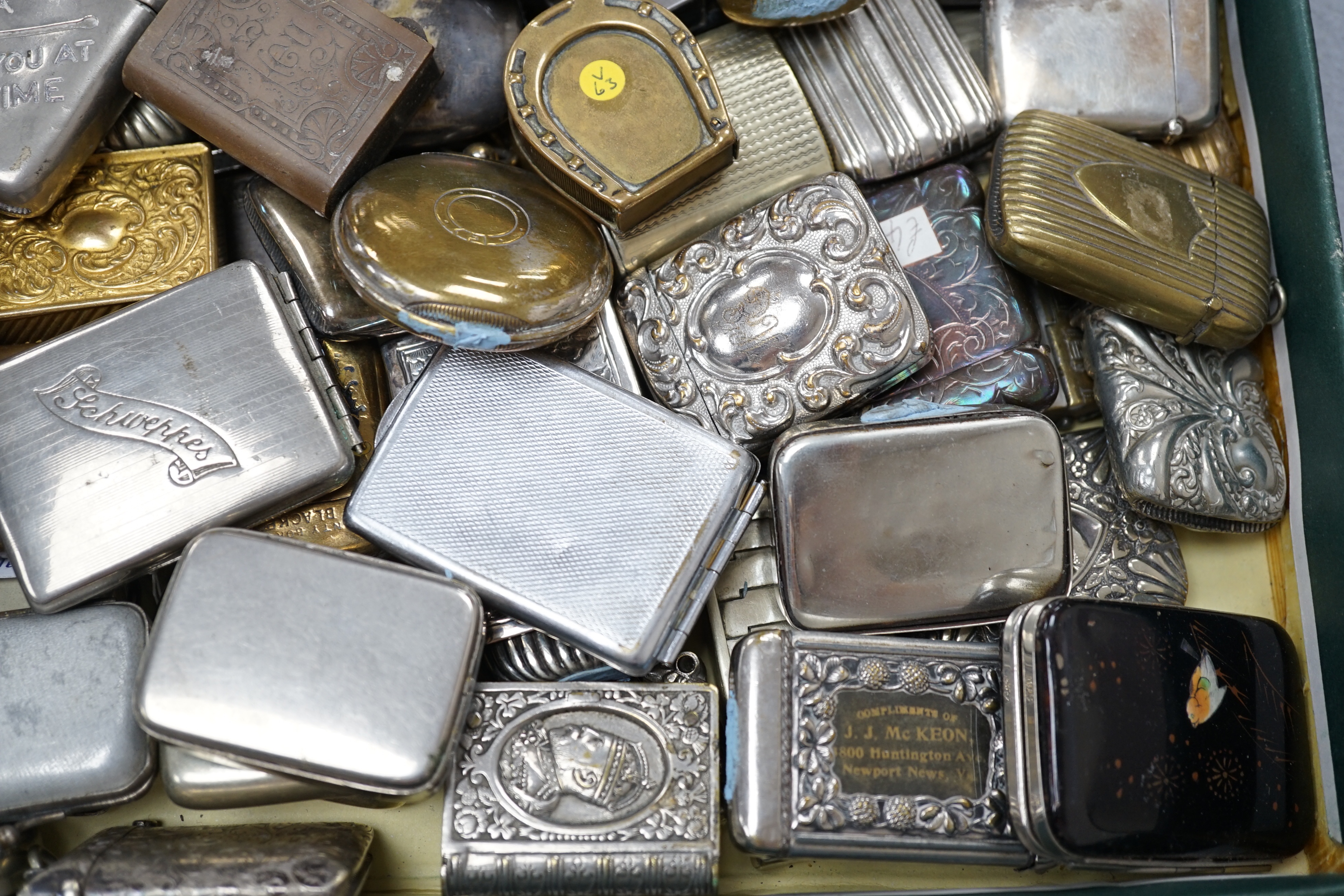 A large collection of mixed metal vestas including brass and copper